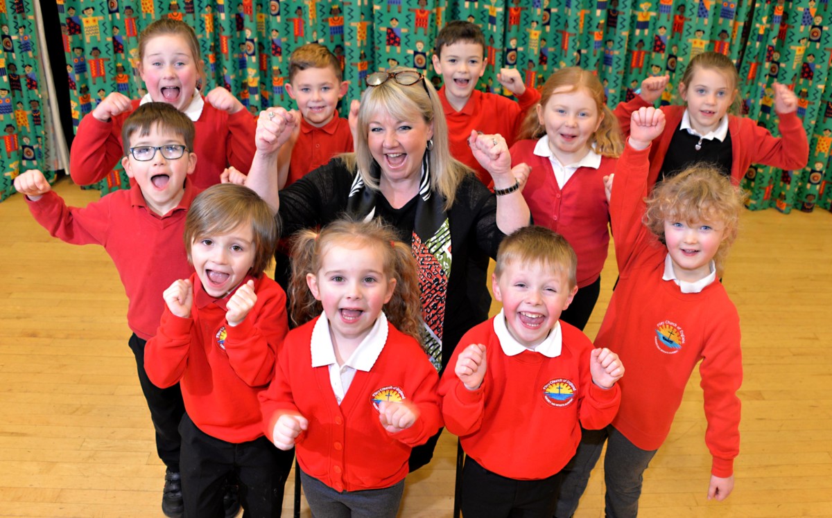 FileyInfantsOfstedFeb2020 Mrs Angela Clark with pupils of Filey Church of England Nursery and Infants Academy, celebrating their ‘Good’ rating from school inspectors Ofsted.